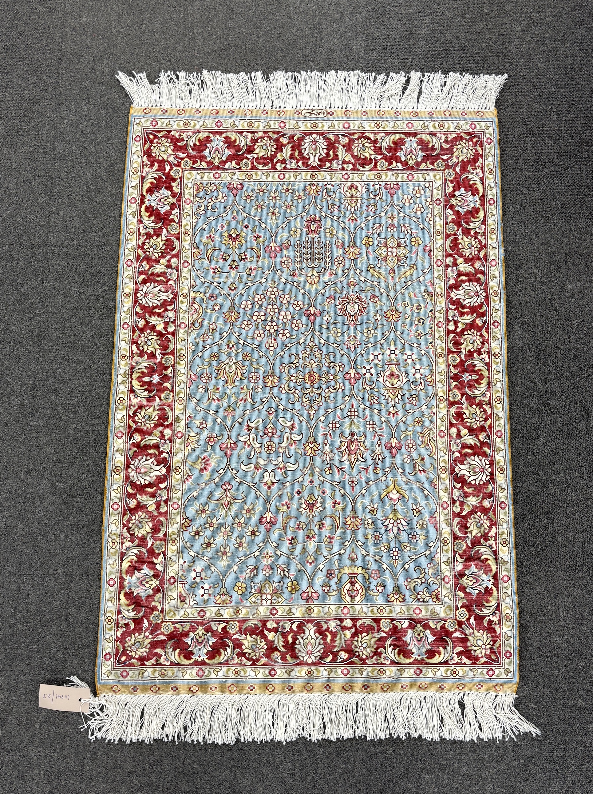 A North West Persian part silk blue ground mat, 90 x 60cm.